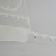 A close-up view of the area, where some caulk-like sealant came loose.